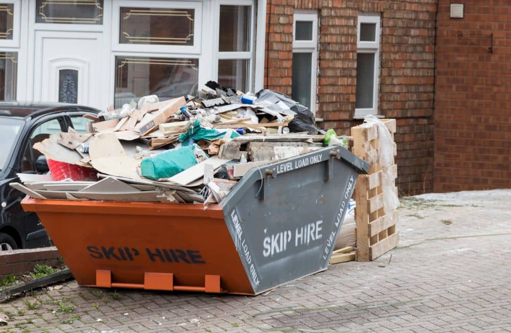 Skip bin for hire filled with domestic household waste